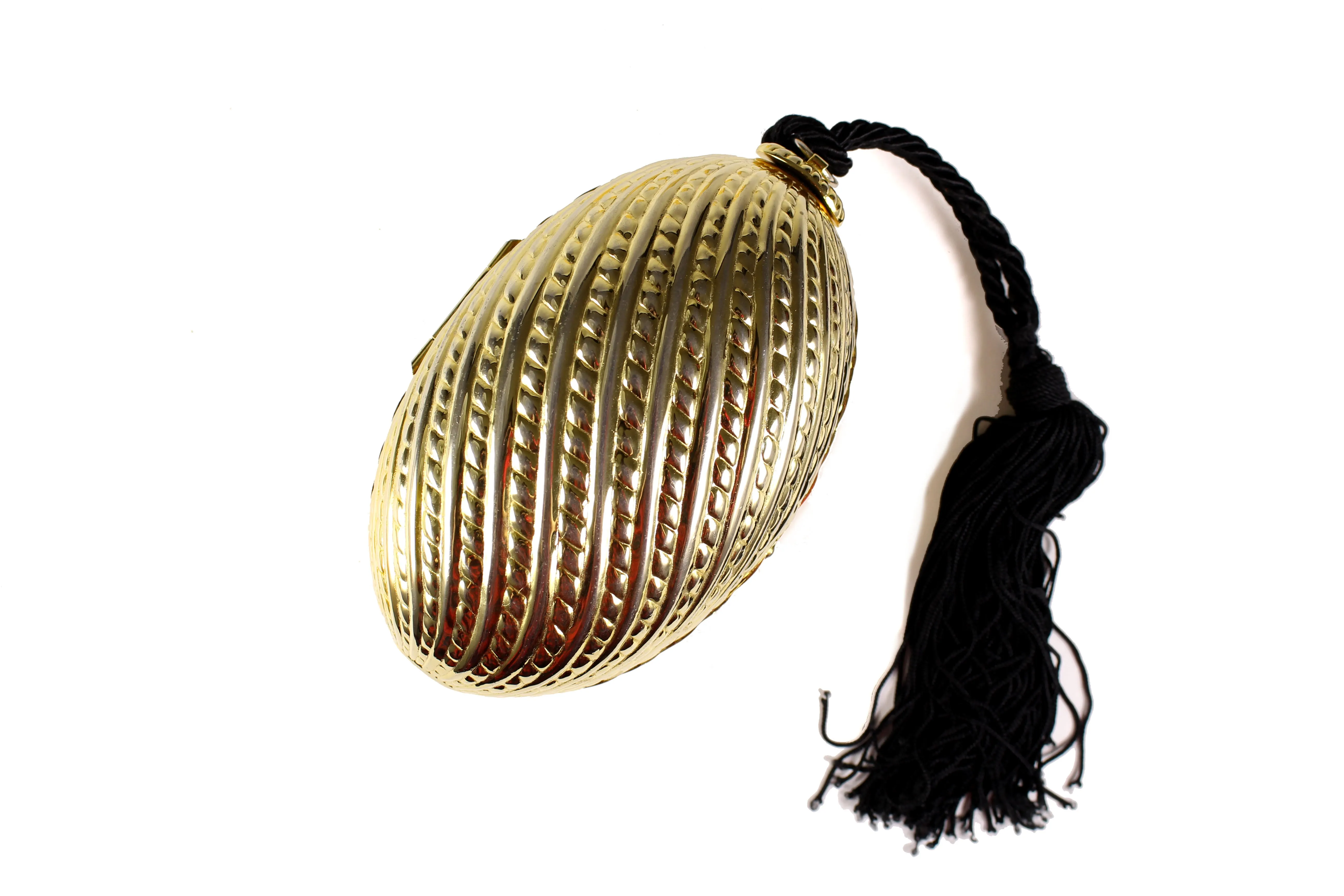 Golden egg clutch with wrist tassel