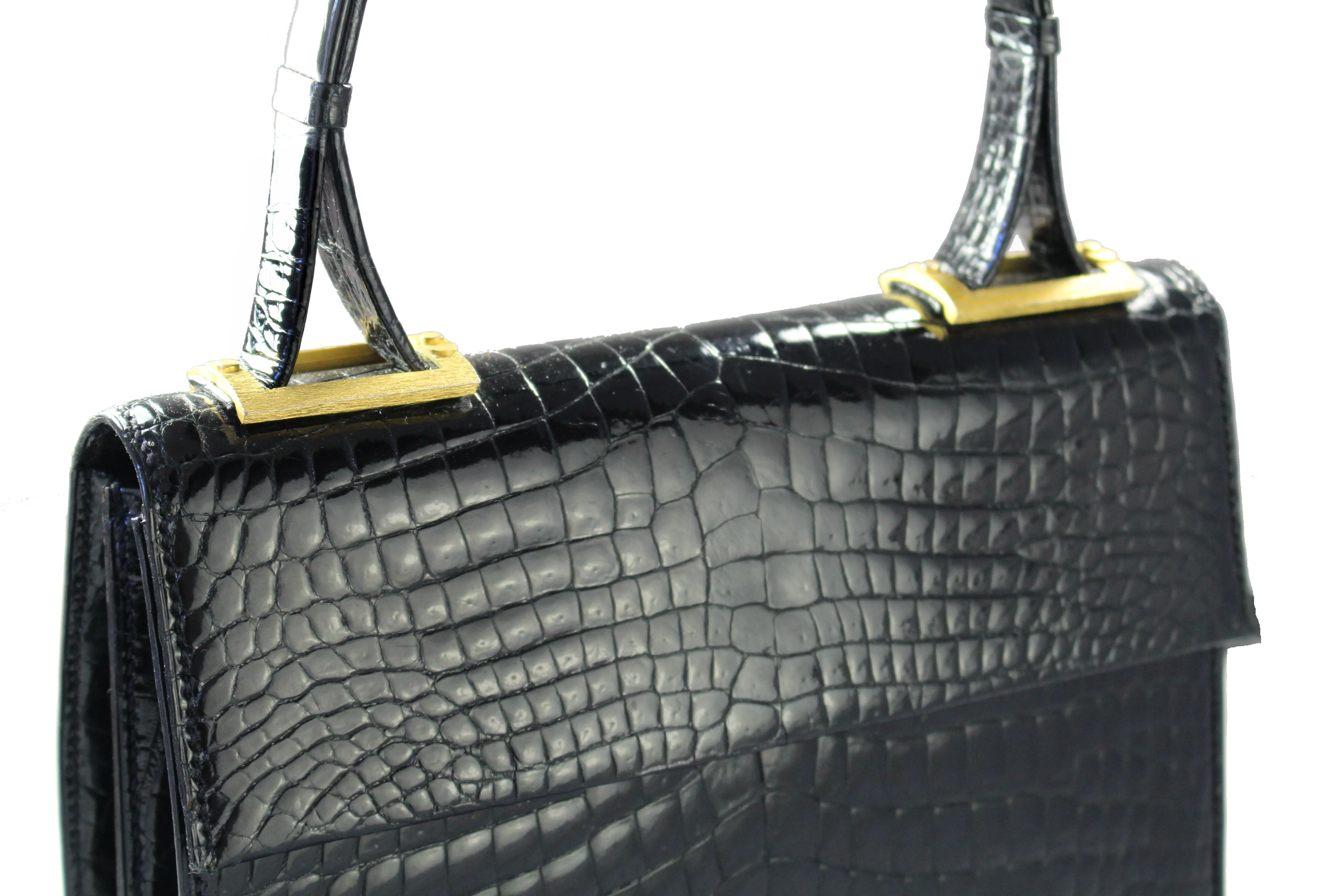 Jet black baby crocodile handbag with decorative handle