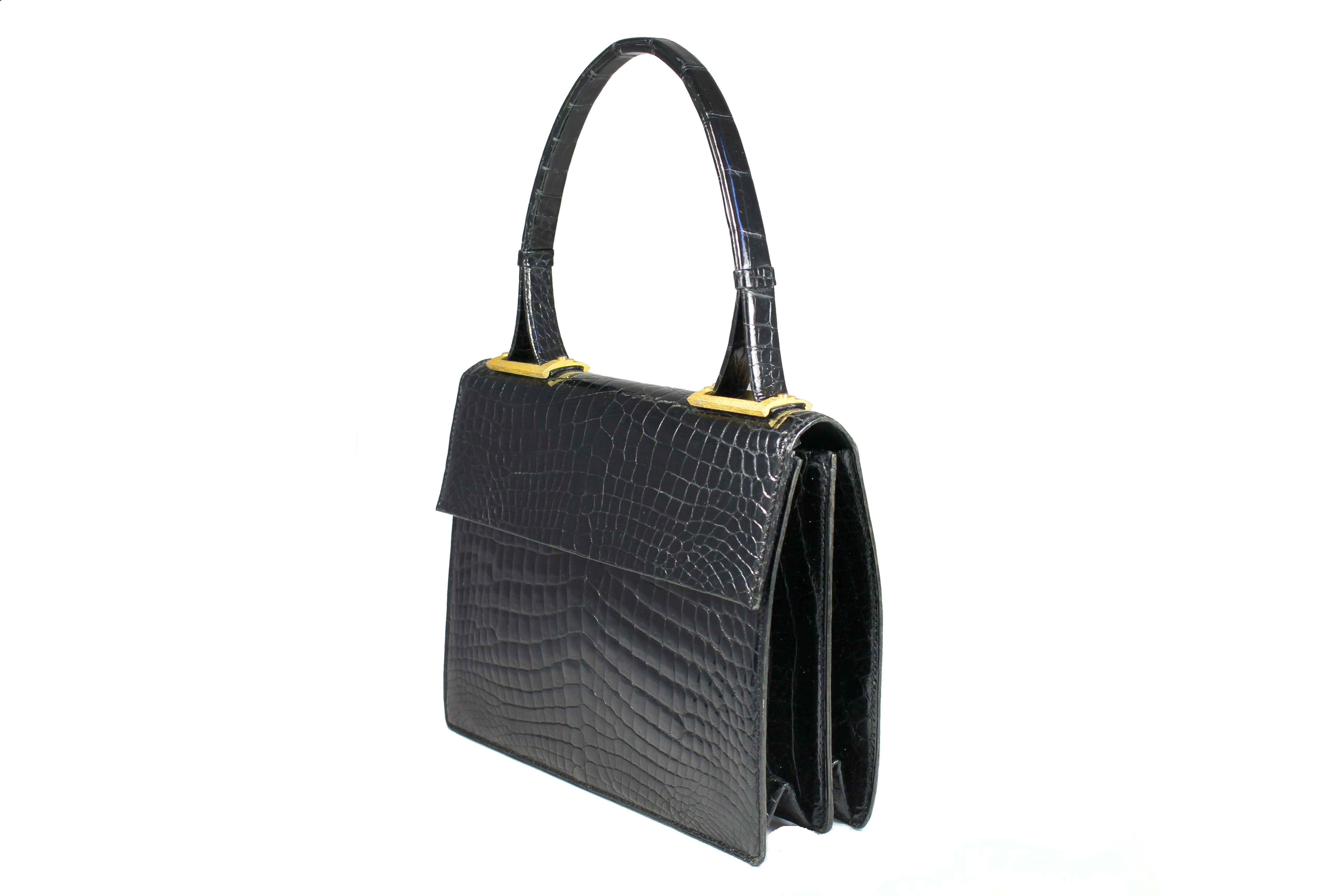 Jet black baby crocodile handbag with decorative handle